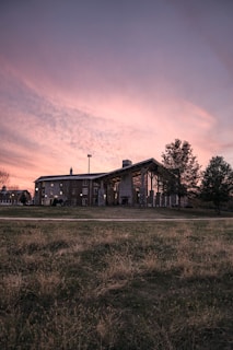 A newly built residential extension blending seamlessly with the original structure in soft evening light