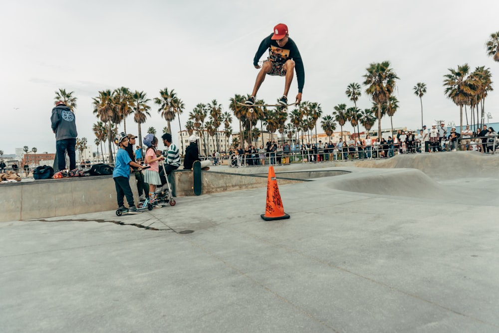 man doing skateboarding stunts during daytime