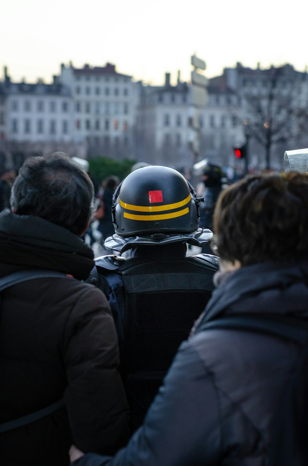 three people in black jackets in close-up photography