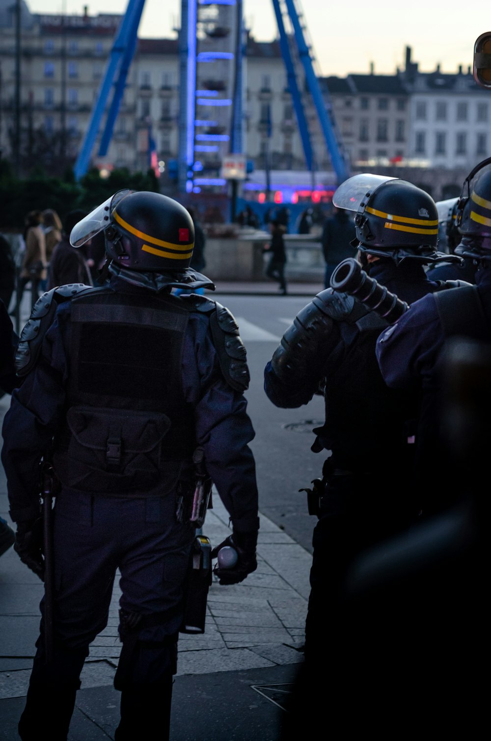 officers standing on pavement road