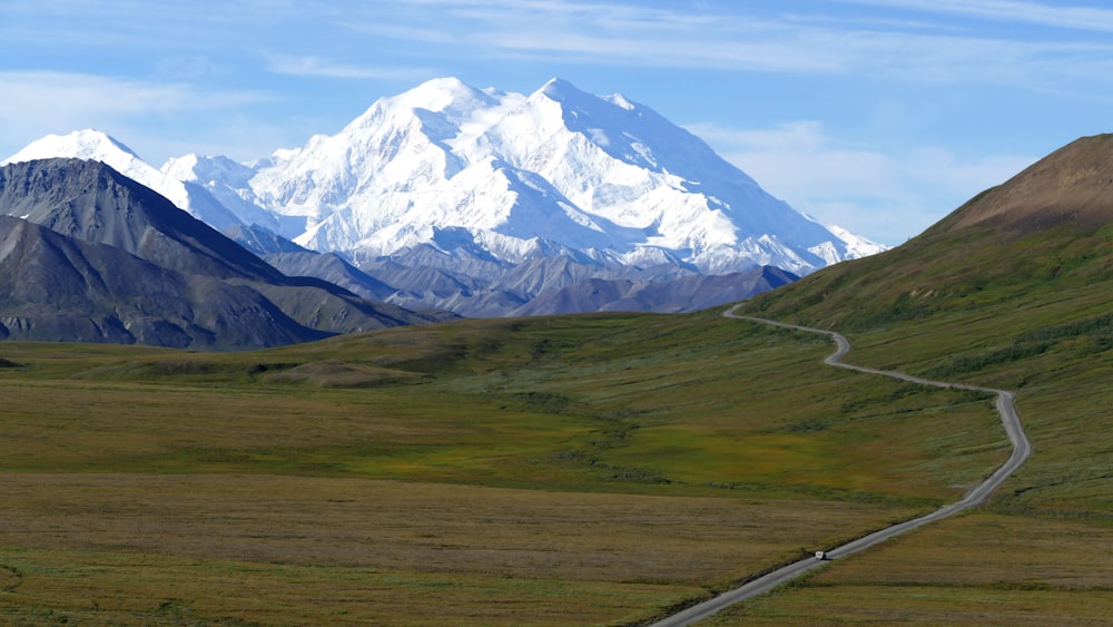 winding road under blue sky