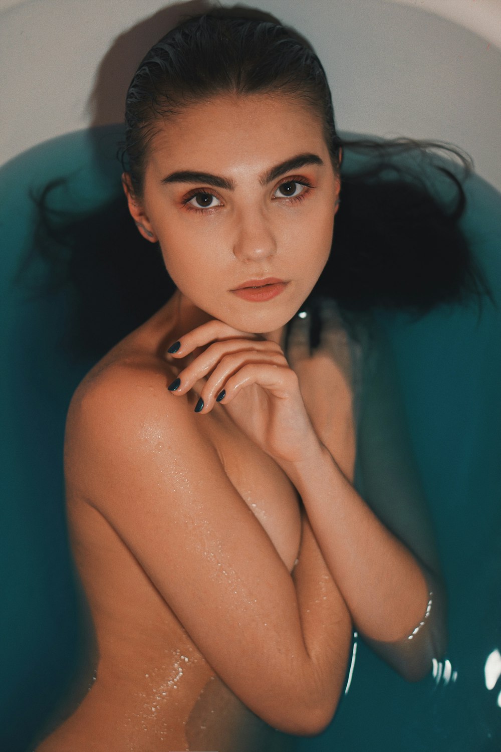 half naked woman on bathtub