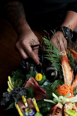 person fixing vegetables with flowers