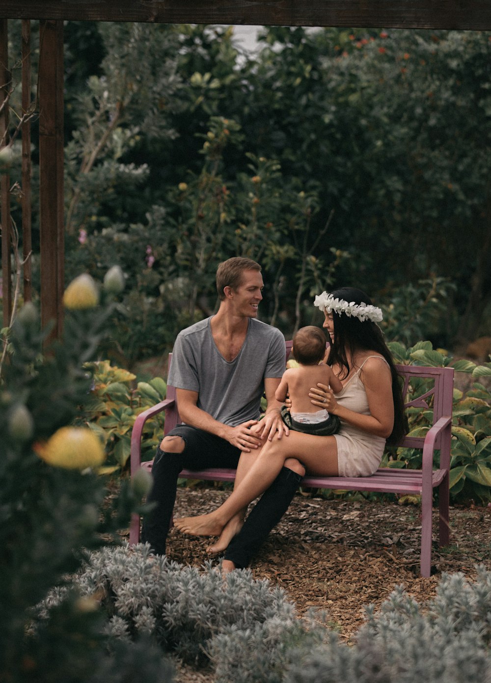 family sitting on a bench