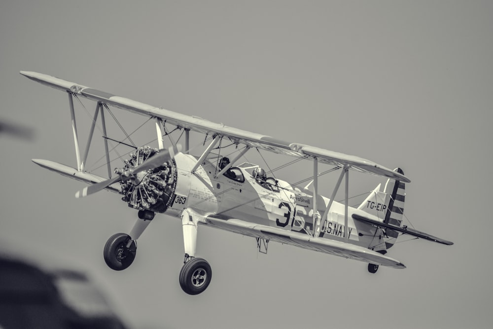 grayscale photography of biplane