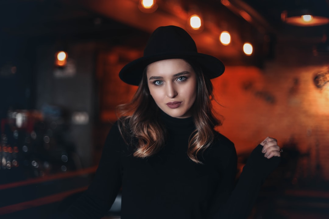 woman in black fitted sweater inside bar