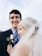 A happy groom in a stylish tuxedo from Anthony Richards Formal Wear.