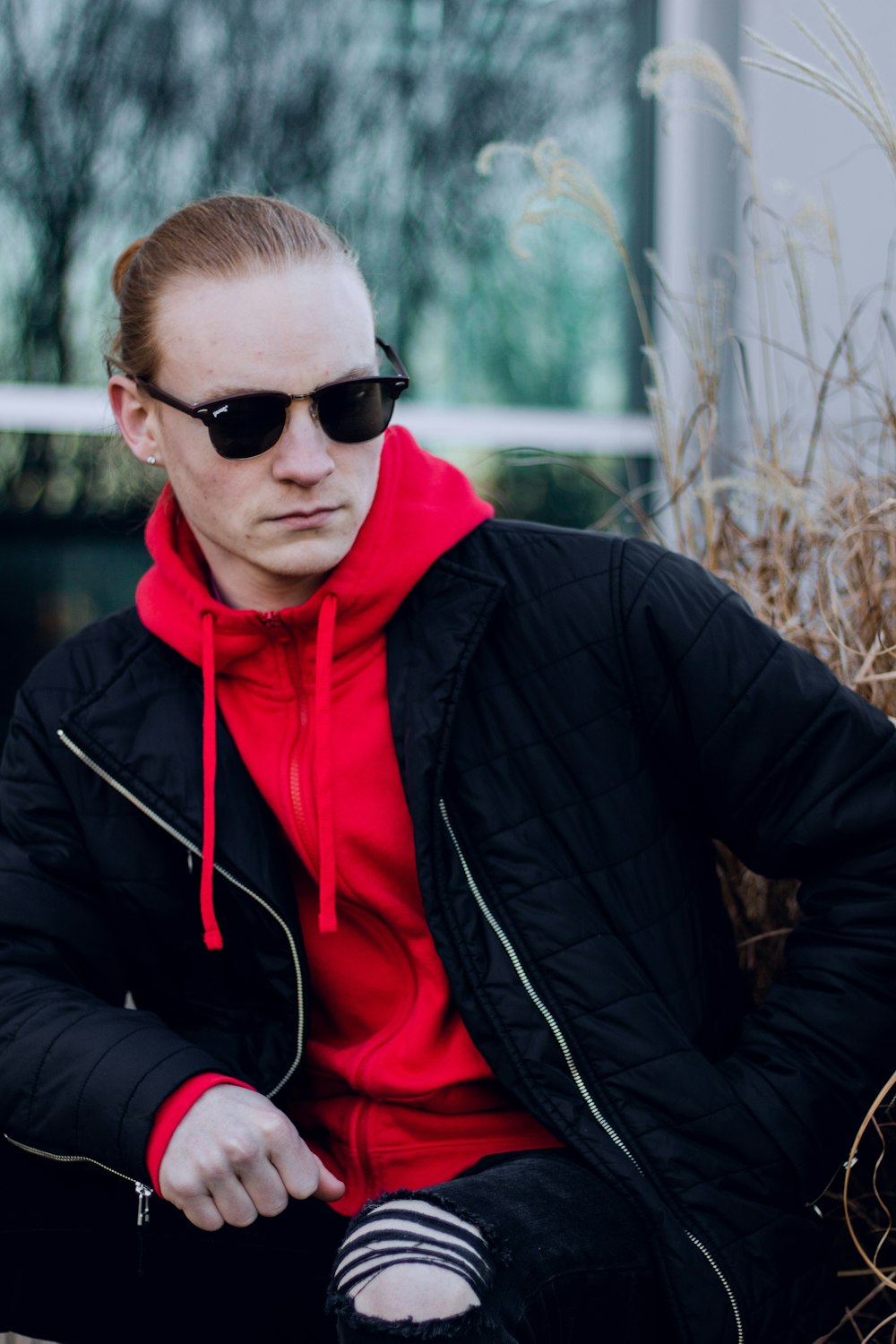 sitting man wearing black sunglasses