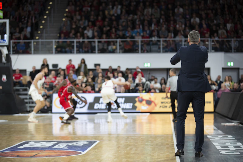 Basketball players competing during a game