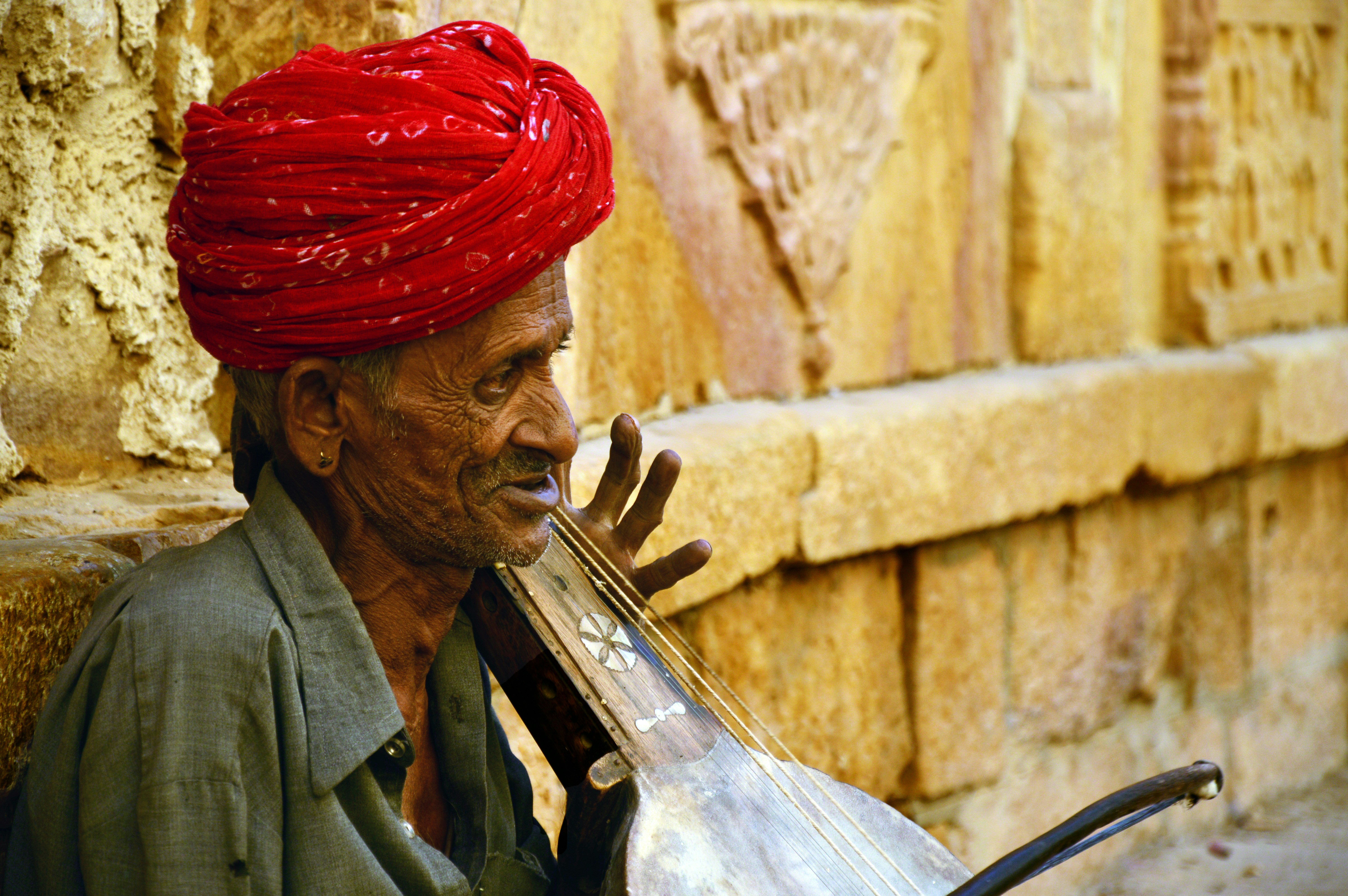 man wearing red turban headdress