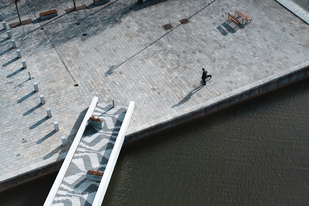 aerial photography of person standing near bench