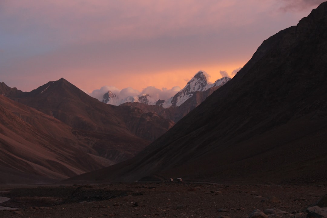 snow capped mountain under white clouds