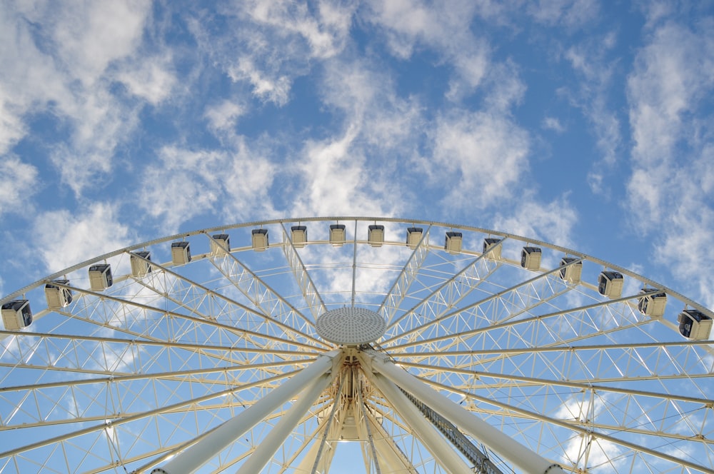 white huge ferries wheel and a blue sky