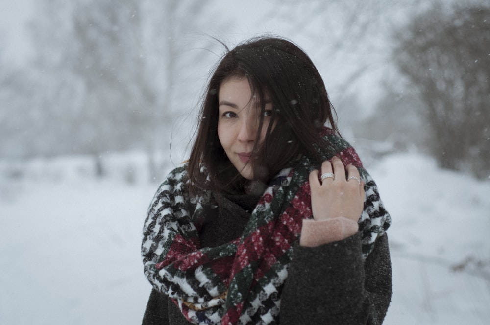 selective focus photography of woman in red and white scarf