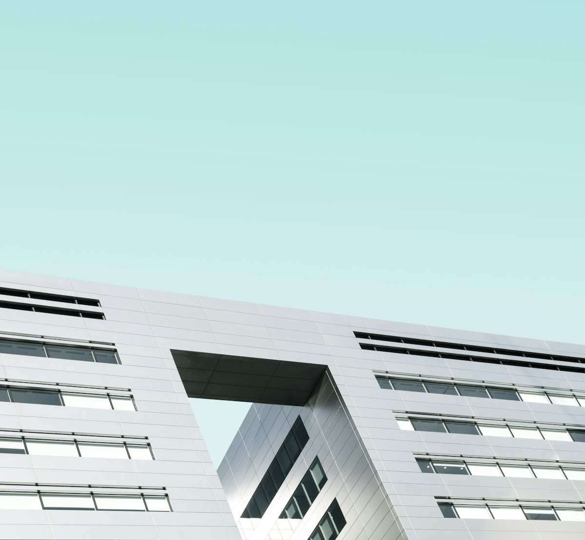 Family cycling past Amsterdam canals — Netherlands family travel.