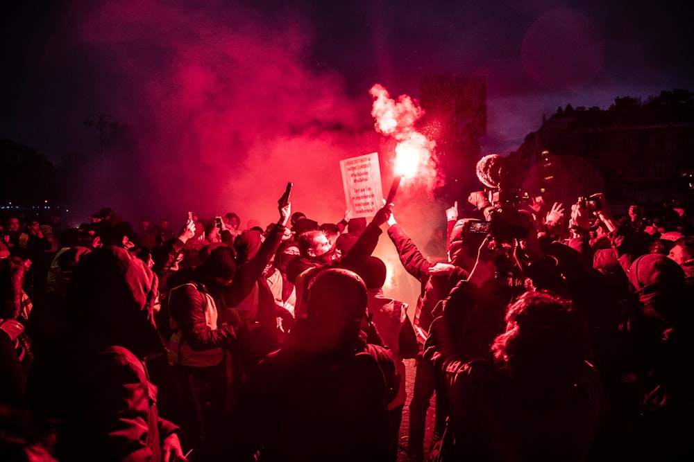 person holding flare
