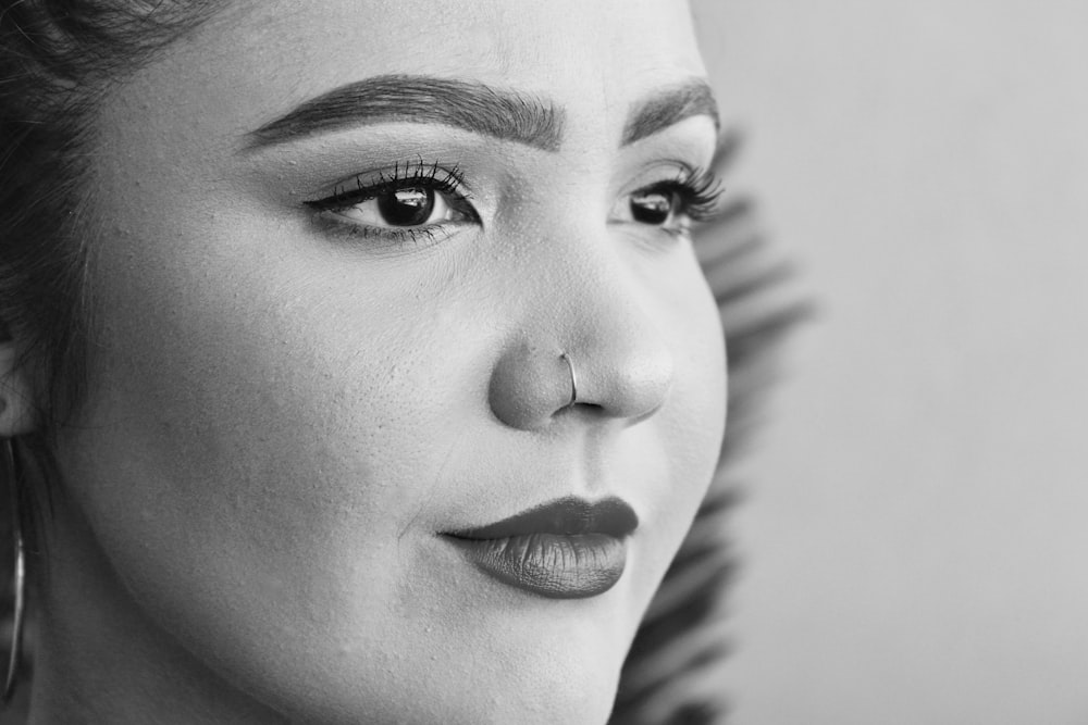 shallow focus photo of woman wearing nose hoop