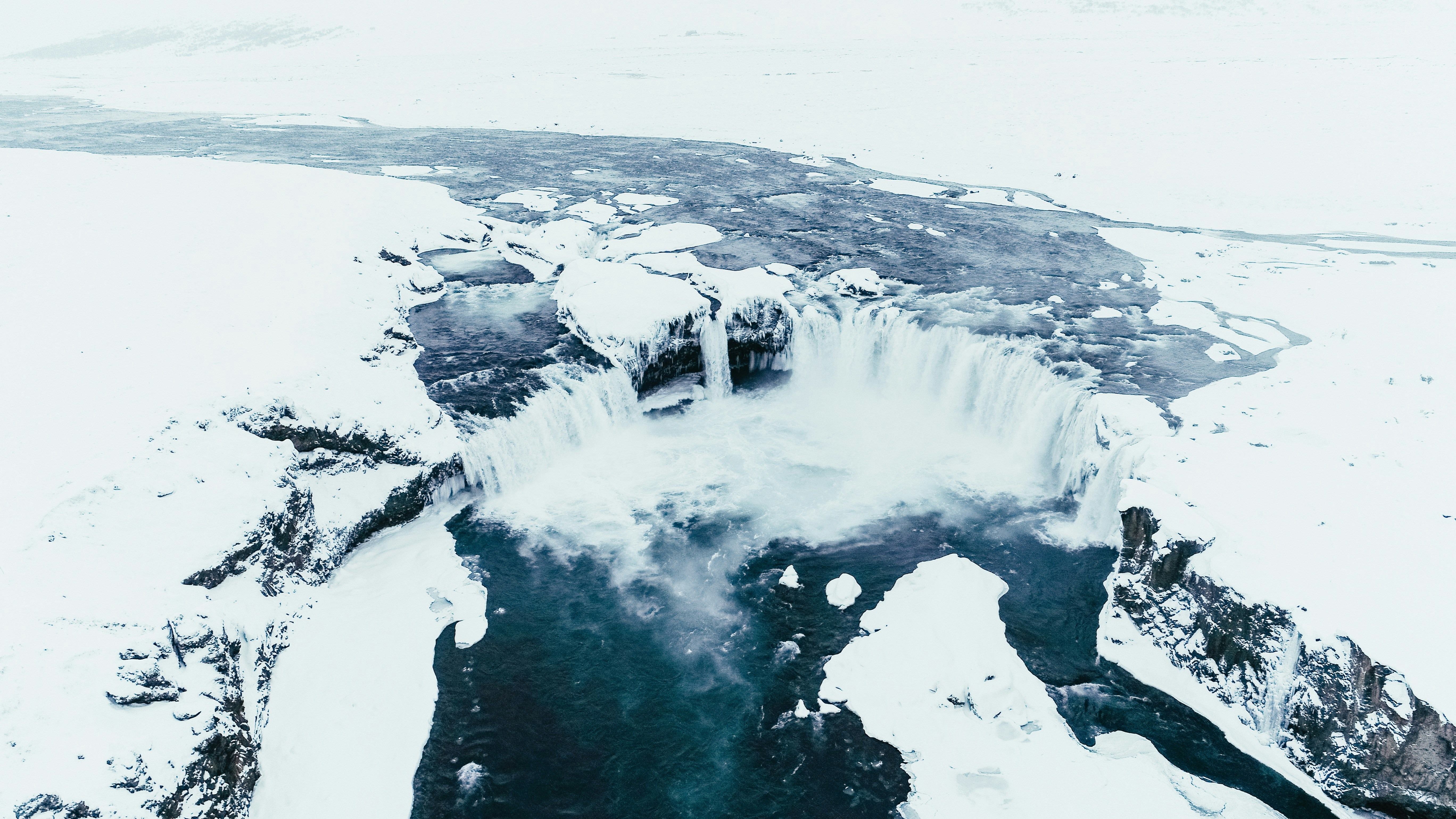 lake surrounded by rock formations