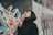 woman wearing black drawstring hoodie near concrete wall