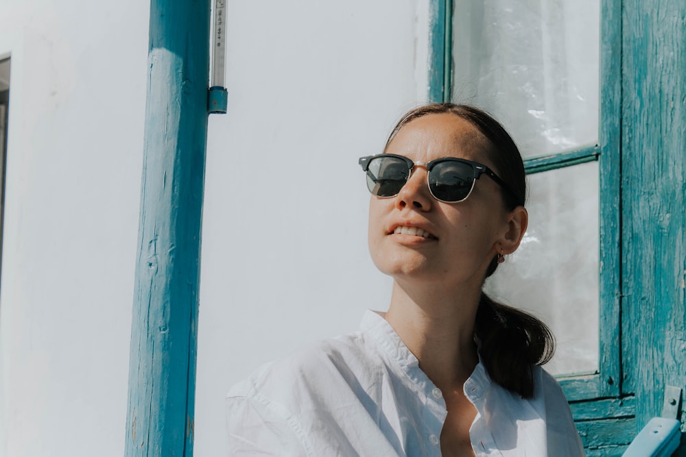 woman wearing black clubmaster sunglasses