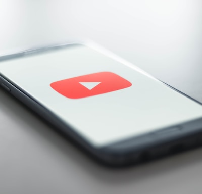 a close up of a cell phone with a youtube logo on it