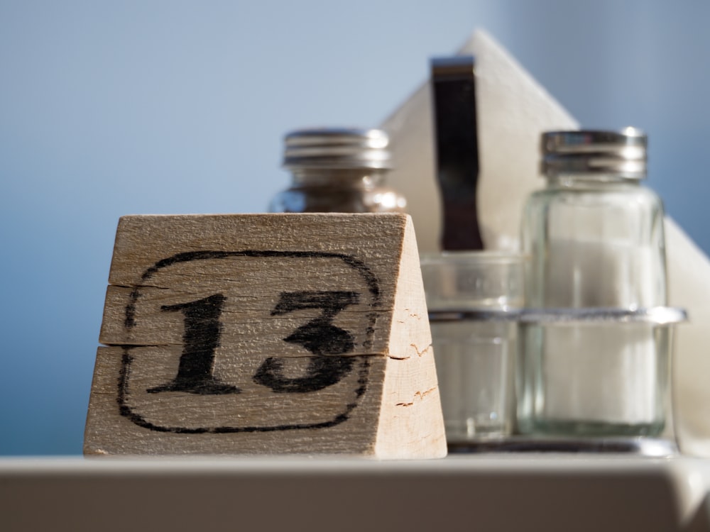 brown 13 printed block beside clear condiment shakers