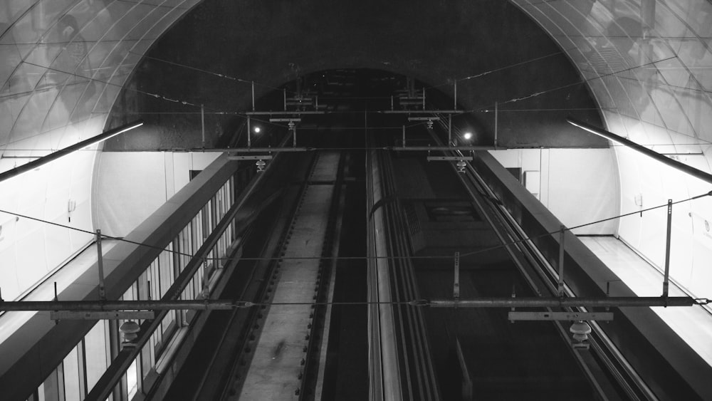 grayscale photo of a train station