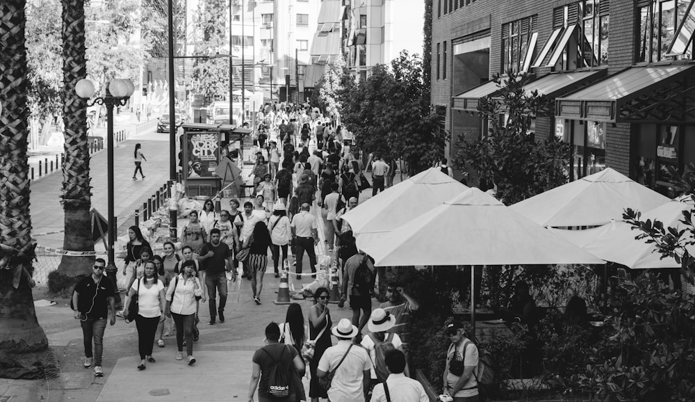 grayscale photo of people walking on street