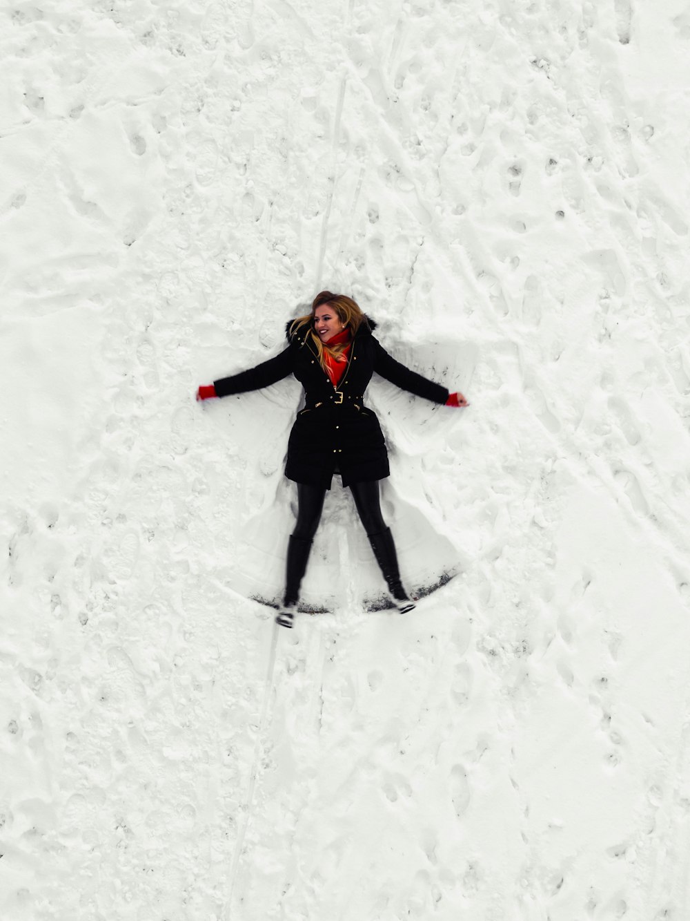 woman making snow angel