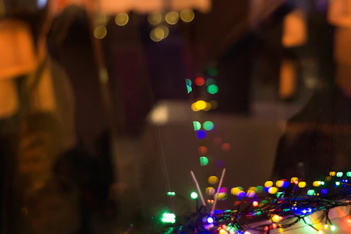 Whimsical playroom background softly blurred with colorful lights and toys.