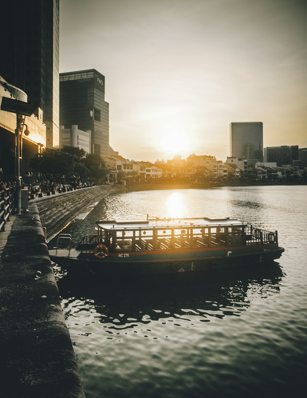 empty tour boat on dock during daytime