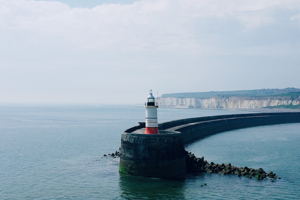 lighthouse near ocean during daytime