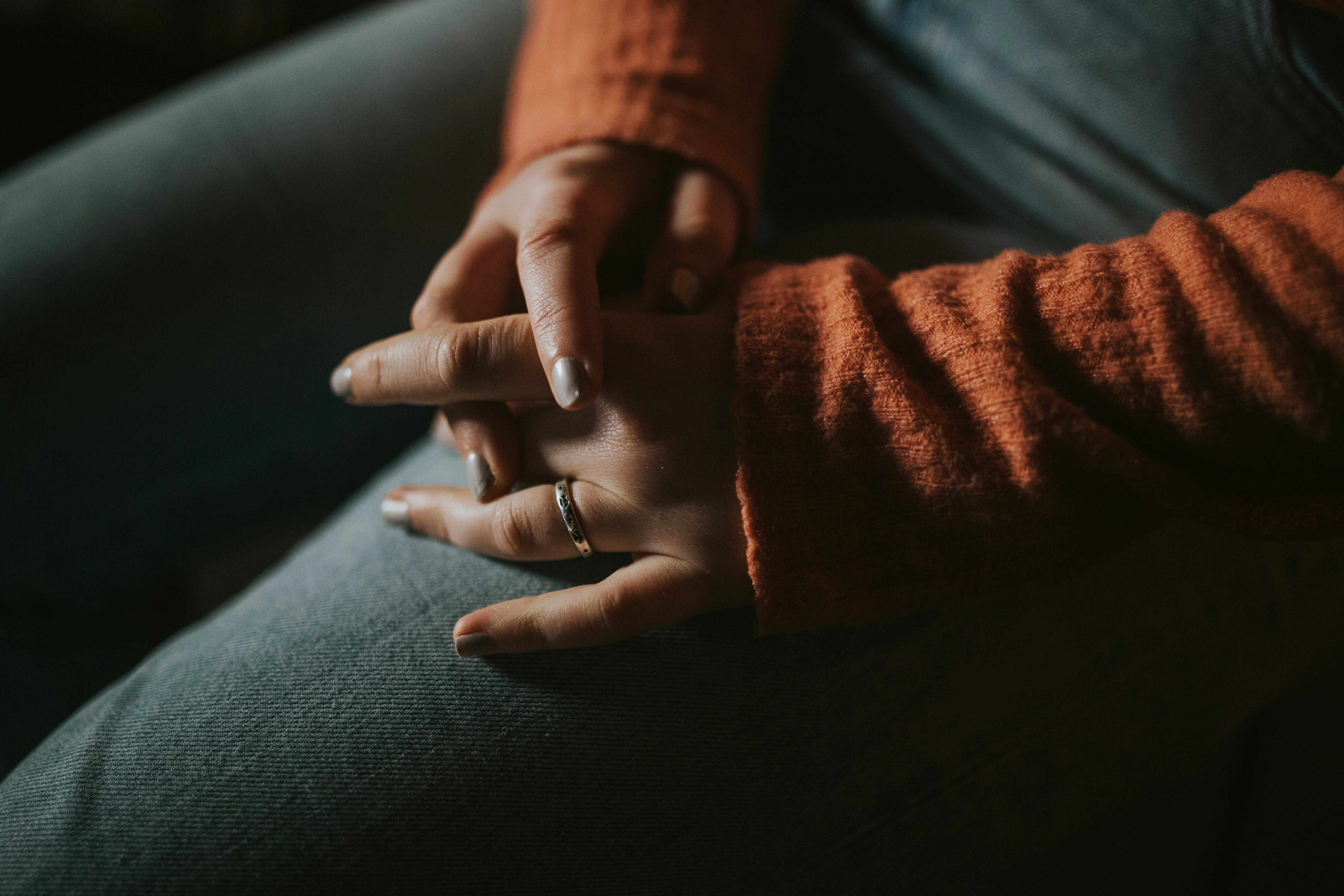 person wearing silver-colored ring