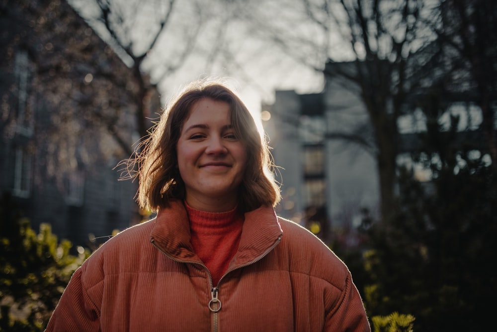 shallow focus photo of woman in pink full-zip jacket