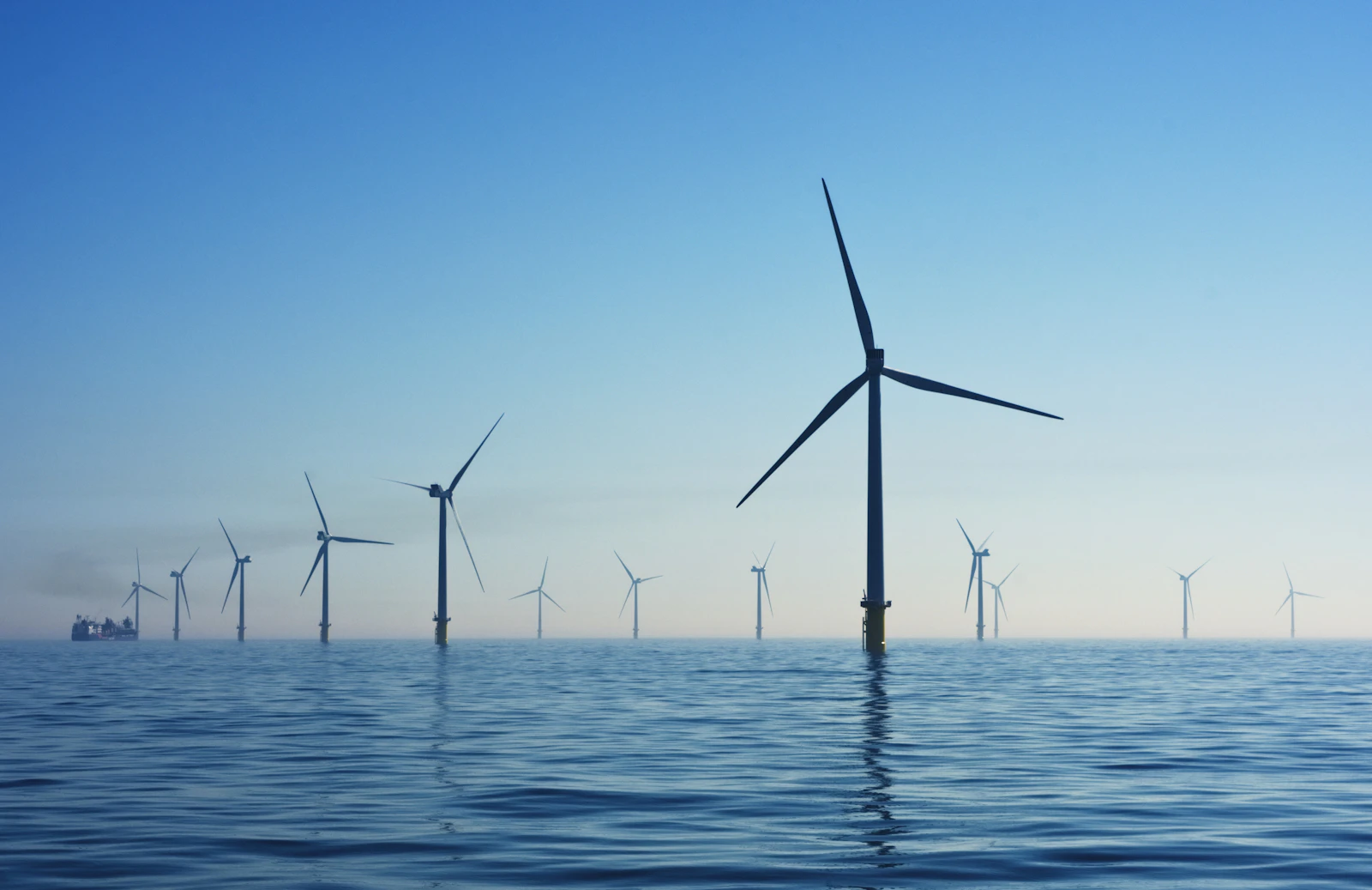 Offshore wind turbines in open water representing clean energy infrastructure
