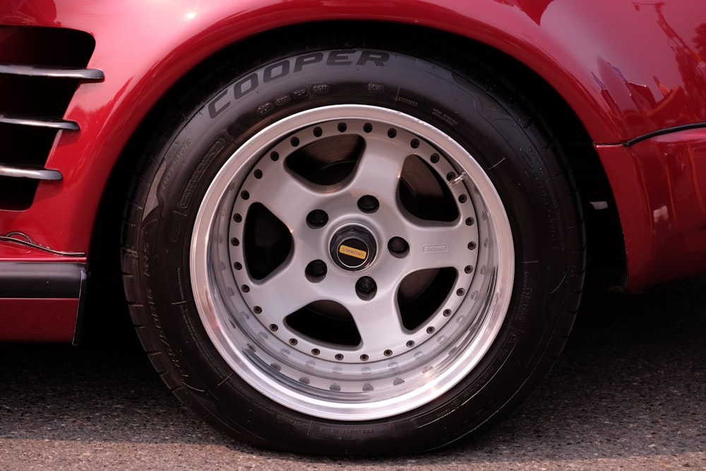 close-up photography of gray multi-spoke wheel and Cooper tire