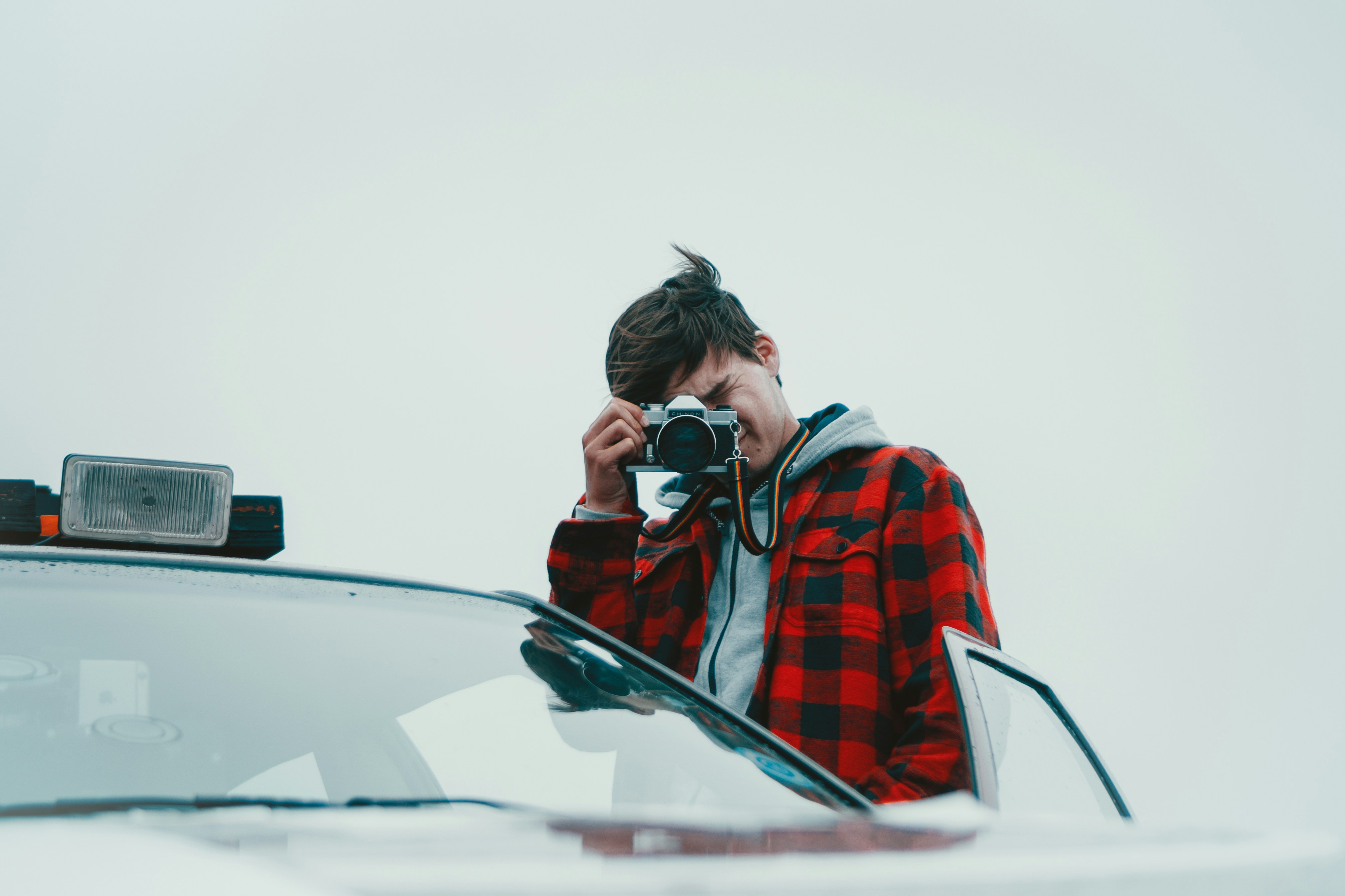 person taking photos of a car accident - rideshare accident lawyer Santa Ana