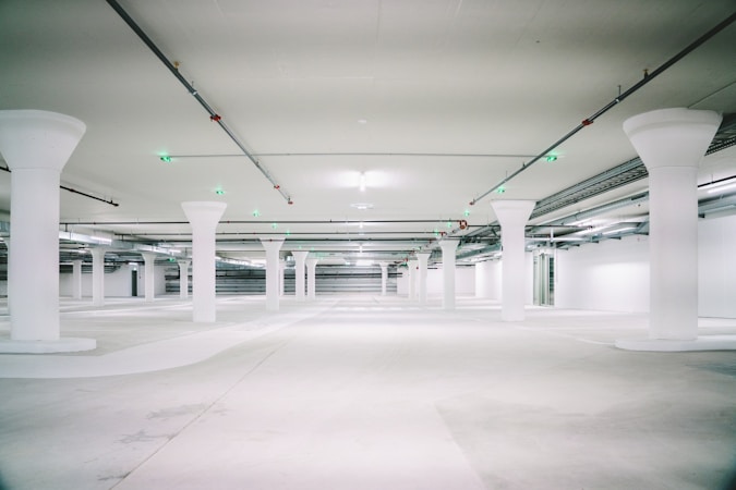 Empty multi-level concrete parking structure, illustrating the 1,000-space parking waiver granted above the 852-space cap for the Las Vegas medical office project