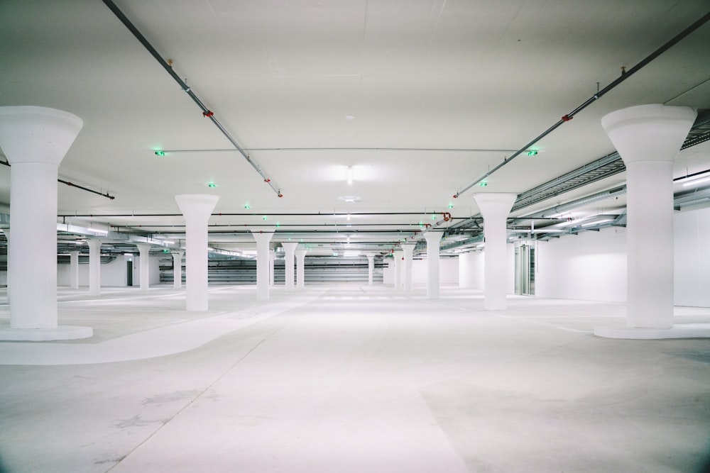 empty white concrete pillared parking lot