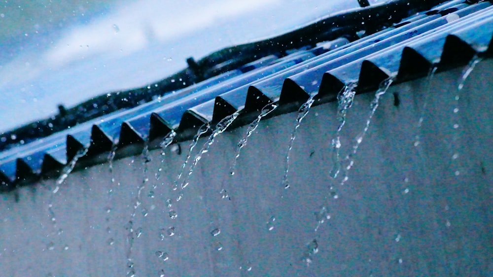 gray roof sheets with water