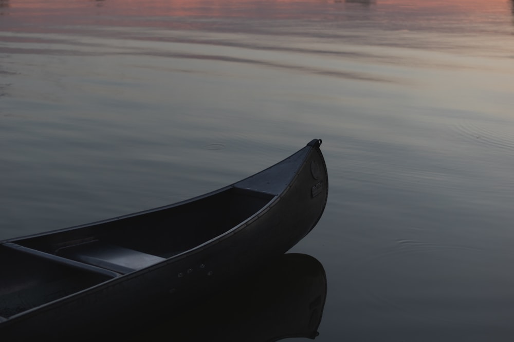 empty canoe boat on calm water