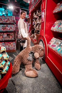 Brightly lit shelves filled with teddy bears and dolls in a playful store setting