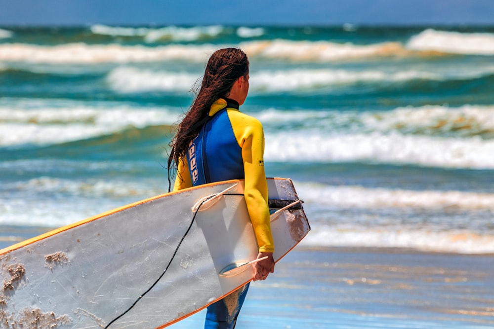 woman carrying surboard