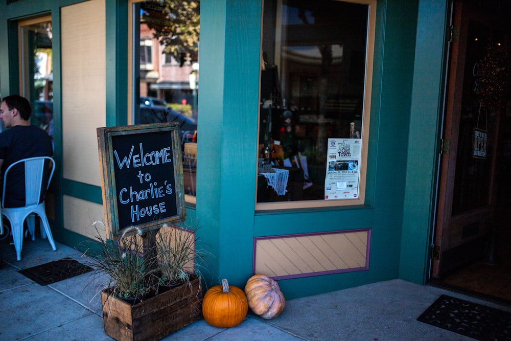 black and brown Welcome signage