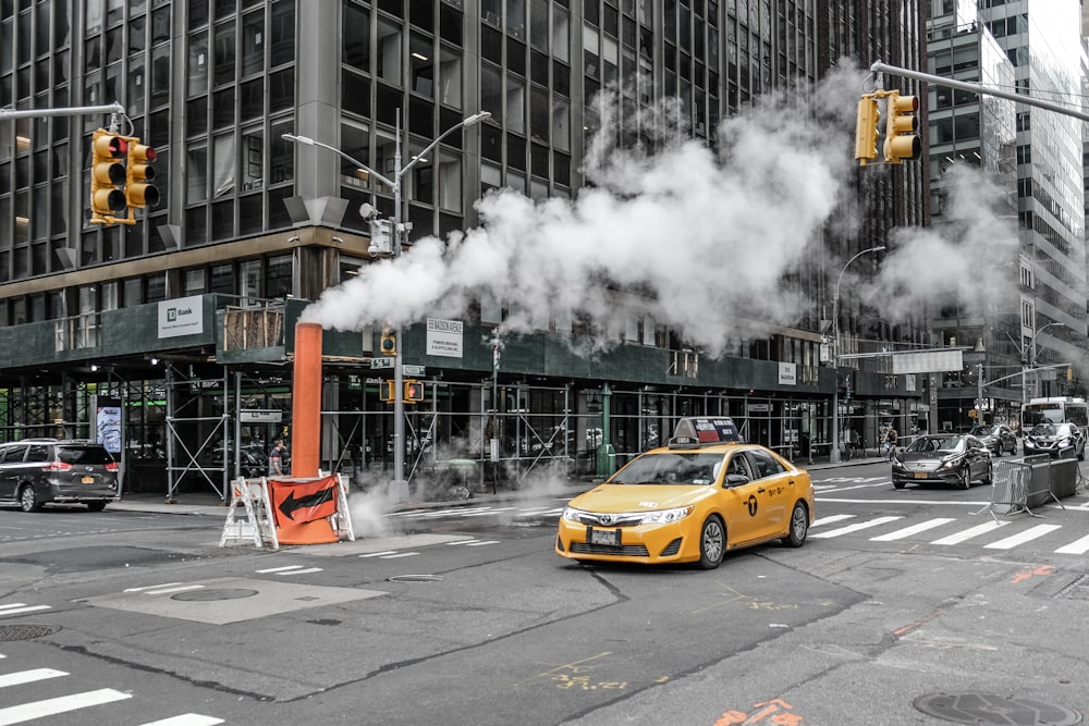 yellow car on road