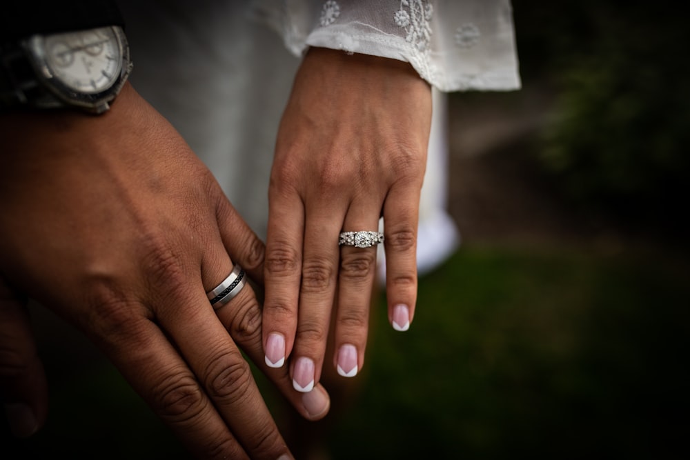 couple wearing wedding rings