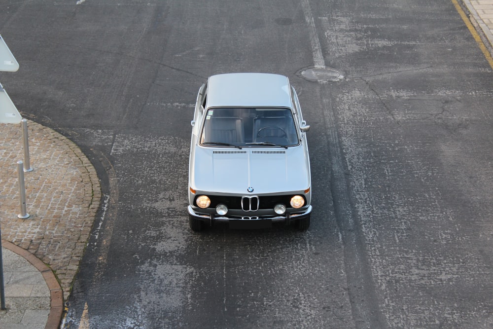 white BMW E30 on road