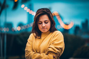bokeh portrait photography of woman wearing sweatshirt