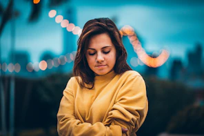 bokeh portrait photography of woman wearing sweatshirt