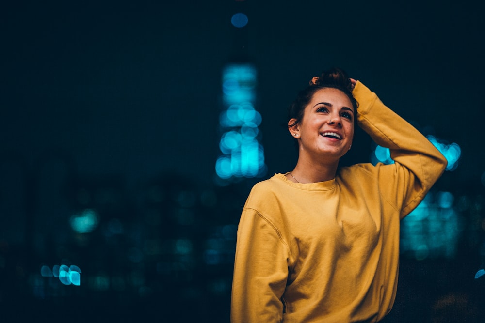 woman in yellow sweater on selective focus photography